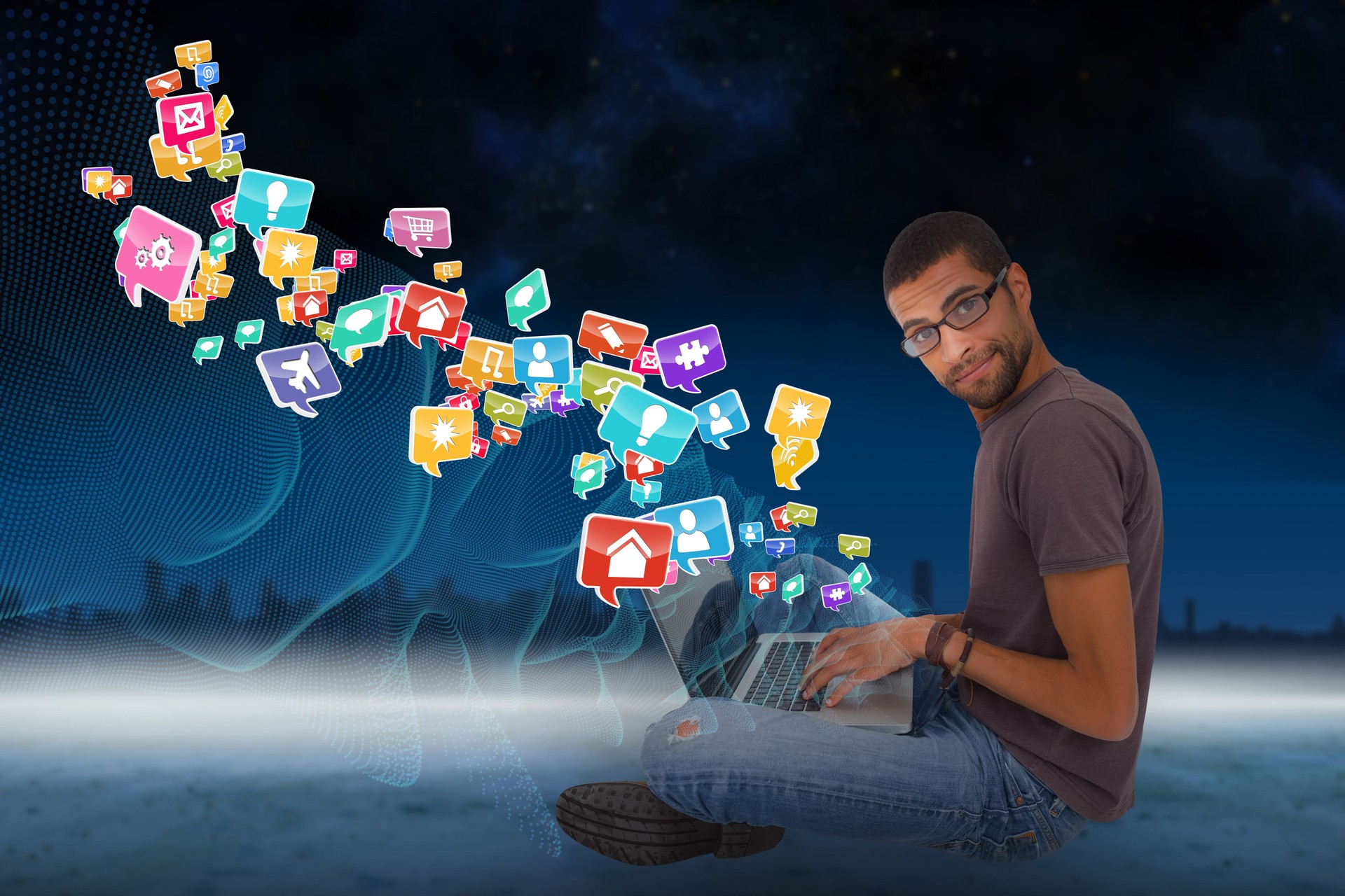 Casual man using laptop with app icons